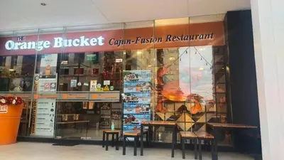 a store with tables and chairs in front of a store at Tiny home near NAIA Terminal 3 in Manila