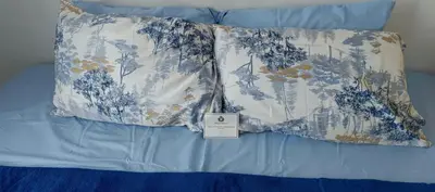 two pillows on a bed with a price tag on them at SEA RESIDENCES STAYCATION near MOA by Mae in Manila