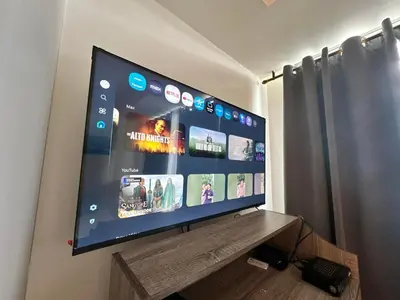 a flat screen tv sitting on top of a table at 1BR Condotel in Azure Urban Resort Near NAIA #BH1 in Manila