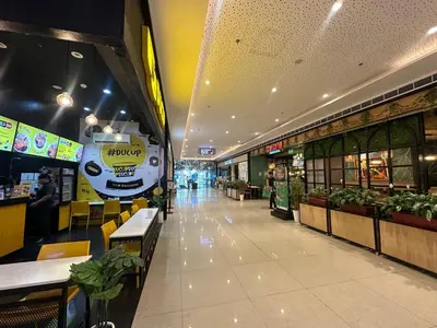 a shopping mall with a food truck on the wall at Air Residences staycation2 in Manila