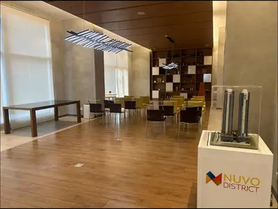a lobby with a dining area with a table and chairs at A peace crib Eastwood in Manila