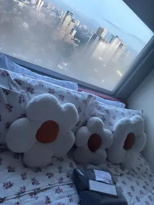 two stuffed teddy bears sitting on top of a bed at Columbres Place in Manila