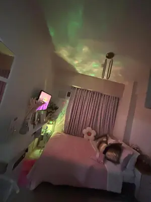 a bedroom with a bed with a teddy bear on it at Columbres Place in Manila