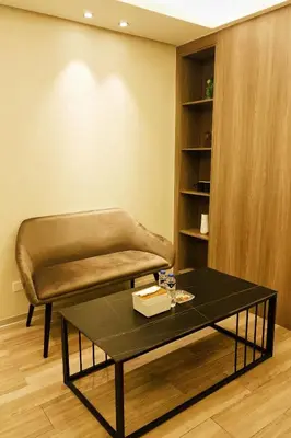 a living room with a couch and a coffee table at Happy Holiday in Manila