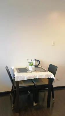 a table with a table cloth on it with chairs at The Spot 43 Sunrise in Makati in Manila