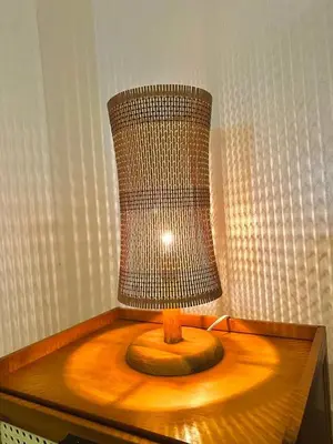 a lamp sitting on top of a wooden table at Hiraya Pod Staycation Netflix Balcony Beach Escape in Manila