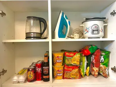 a refrigerator filled with lots of food and drinks at Hiraya Pod Staycation Netflix Balcony Beach Escape in Manila