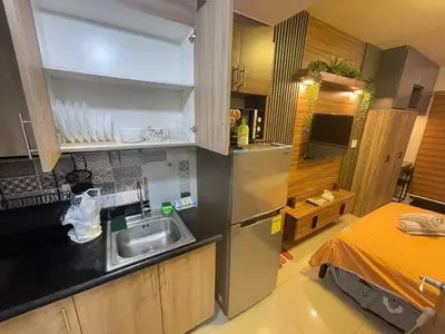 a kitchen with a sink and a counter top at Shore 2 tower 2 near moa in Manila