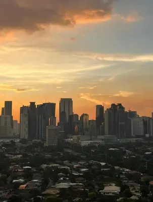 a view of a city skyline at sunset at Aiko's Haven at Kasara in Manila