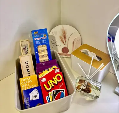 a lunch box with snacks and a mirror on a table at Stylish City Escape in Manila