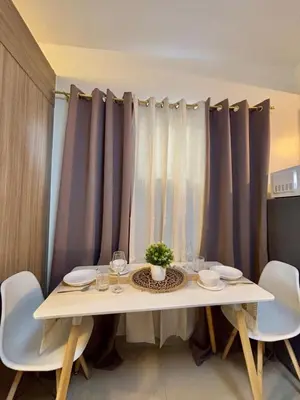 a white table with a potted plant on it at Chic City Escape by the Bay in Manila
