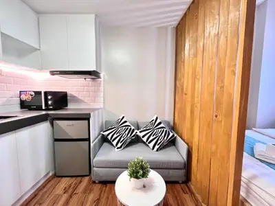 a small living room with a couch and a table at 1BR Condotel Ridgewood Towers Near BGC Airport #RW17 in Manila