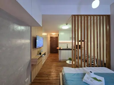 a room with a bed and a kitchen and a kitchen at 1BR Condotel Ridgewood Towers Near BGC Airport #RW17 in Manila