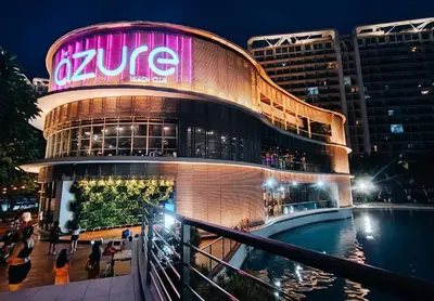 a building with a sign on the side of it at Azure Urban Resort Staycation in Manila