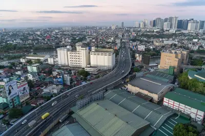 an overhead view of a city with a highway at Consider It Yours - Stay Cozy with City Views in Manila