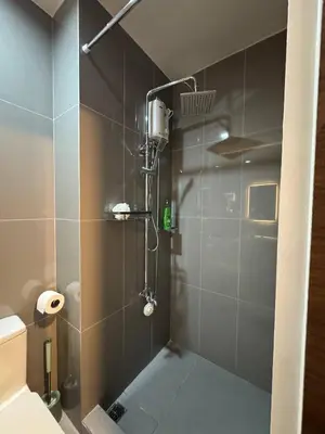 a bathroom with a shower with a glass door at Entire Room in Makati Center with FAST WIFI in Manila