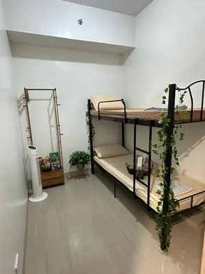 a room with two bunk beds in it at Leaf Residences Muntinlupa - The Mint Pearl Stay 2 bedroom in Manila