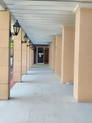 an empty hallway of an office building with lights at Condo MOA with pool access WS811 in Manila