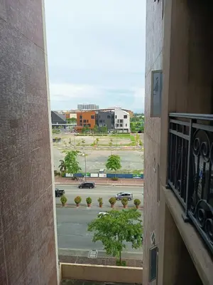 a view of a parking lot from a balcony at Condo MOA with pool access WS811 in Manila