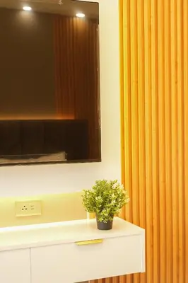 a plant sitting on a counter under a mirror at Hotel Like Staycation 3 Makati with Amazing View in Manila