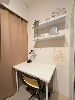 a white desk with a lamp and a chair at ElcaPri Staycation Unit 2 - Shore 2 in Manila