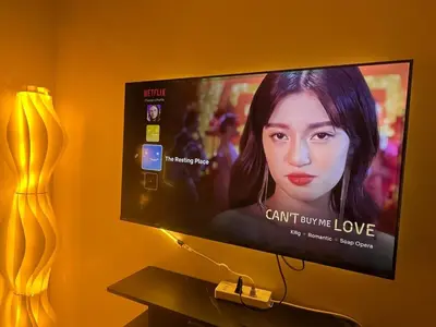 a flat screen tv sitting on a wall at Cozy Minimalist Condo unit in Manila