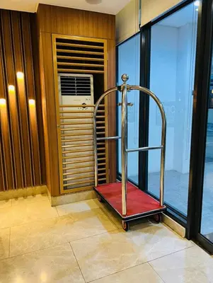 a room with a treadmill in front of a window at Staycation 15 minutes from NAIA with Massage Chair in Manila