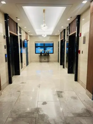 a hallway of a building with a table in it at Staycation 15 minutes from NAIA with Massage Chair in Manila