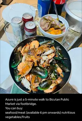 a plate of food with seafood and vegetables on a table at Staycation 15 minutes from NAIA with Massage Chair in Manila