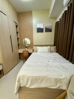 a bedroom with a large white bed in it at Jays BnB in Manila