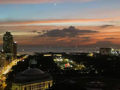 a view of a city at night with lights at Angel's Place Torre De Manila, Cozy 1BR Condo, Sunset View Near all Attractions in Manila