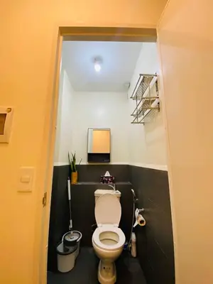 a bathroom with a white toilet in a room at Fully Furnished Studio Type Room for Rent Can be long term or short term in Manila