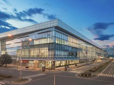 a large glass office building with a lot of windows at City Getaway in the Heart of Entertainment City in Manila