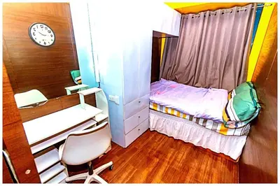 a small room with a small bed and a desk at 2 Bedroom Green Yellow luxury 5549 Makati 300Mb swim in Manila