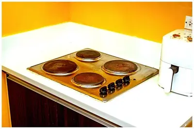 a stove top with three chocolate cakes on it at 2 Bedroom Green Yellow luxury 5549 Makati 300Mb swim in Manila
