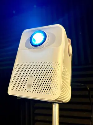 a speaker with a blue light on top of it at Cozy Studio near Nuvali, Enchanted Kingdom - Private Cinema with Netflix & Disney Plus with Free Pool Access in Silang