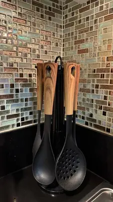 three pairs of rubber utensils hanging on a wall at Spacious Condo at Shell Residences, MOA Pasay - The Urban Stay in Manila