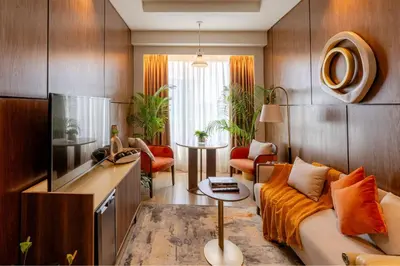 a living room with a couch and a table at Modern City Stay Near Manila Bay Attractions in Manila