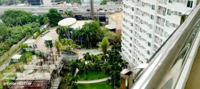 a view from a balcony of a building at Alabang Staycation By Renz in Manila