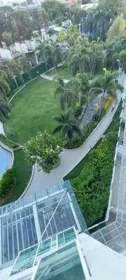 an aerial view of a resort with palm trees and a swimming pool at Alabang Staycation By Renz in Manila