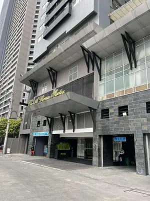 a building with a sign on the front of it at A Venue Residences 9133 in Manila