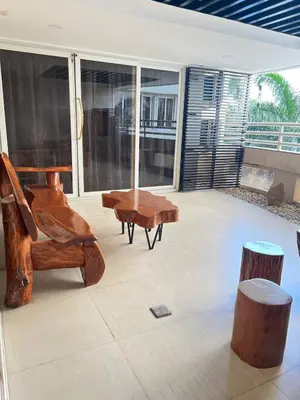 a living room with a piano and wooden furniture at R&R Entire Rental Unit in Manila