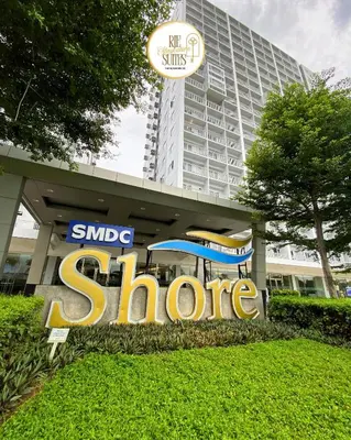 a sign in front of a large building at RJE Staycation Suites Mall of Asia near Airports in Manila