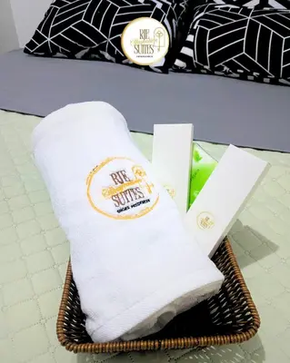 a towel in a basket on a table at RJE Staycation Suites Mall of Asia near Airports in Manila