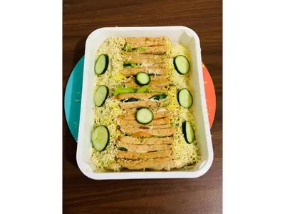 a white dish with a sandwich with cucumbers on it at Fully Furnished Condo for Rent in Manila