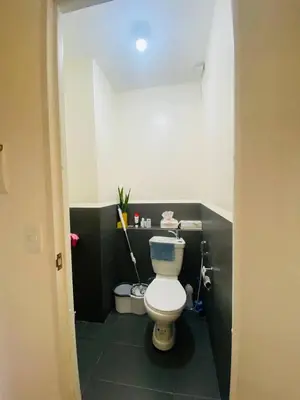 a bathroom with a white toilet in a room at Fully Furnished Condo for Rent in Manila
