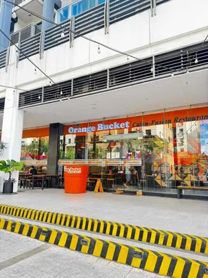 a store front of a building with yellow and white stripes at Chic Unit with Balcony - Free wifi & netflix across Naia Terminal 3 Airport in Manila