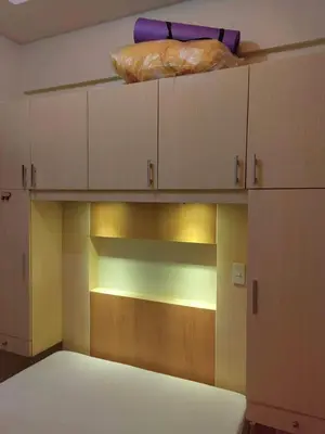 a room with cabinets and a bed in a room at Chateau Elysee A11 near bar resto mall Airport in Manila