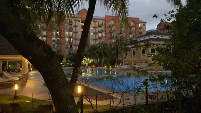 a view of a hotel with a swimming pool at Chateau Elysee A11 near bar resto mall Airport in Manila