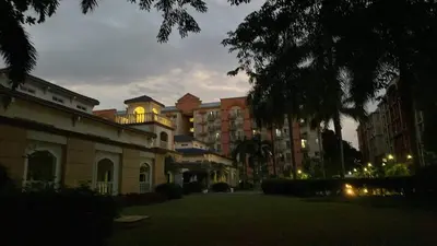 a building with its lights on in a courtyard at Chateau Elysee A11 near bar resto mall Airport in Manila